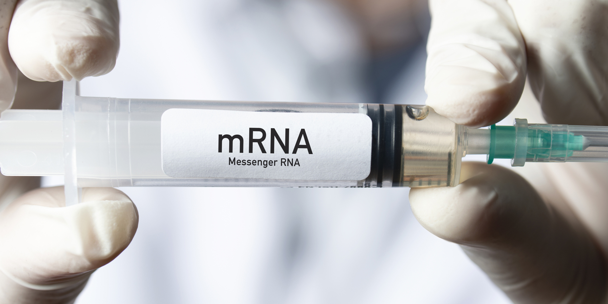 Doctor holding mRNA vaccine. mRNA: Messenger RNA. mRNA is a type of vaccine.